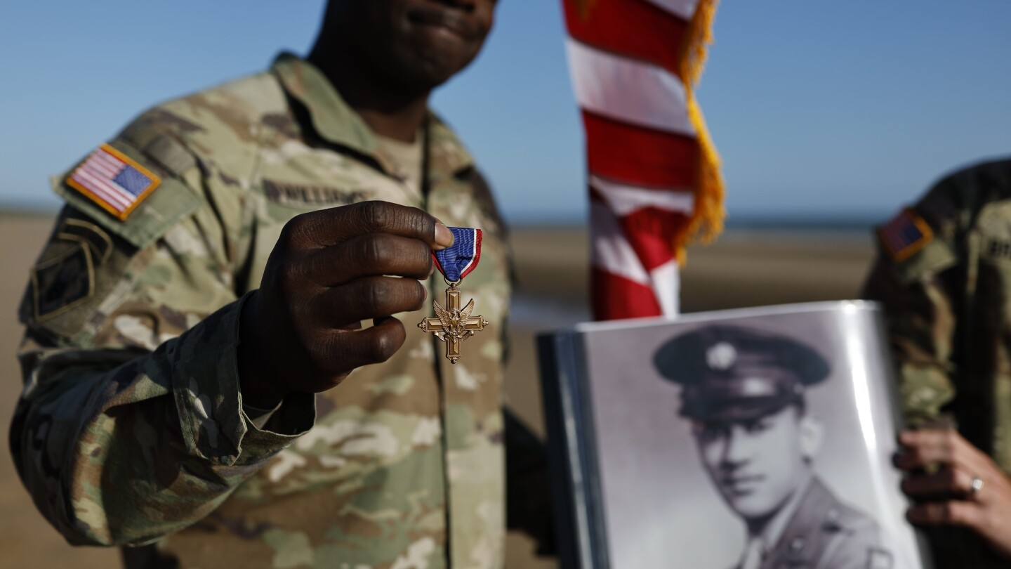 Black D-Day combat medic’s long-denied medal tenderly laid on Omaha Beach where he bled, saved lives