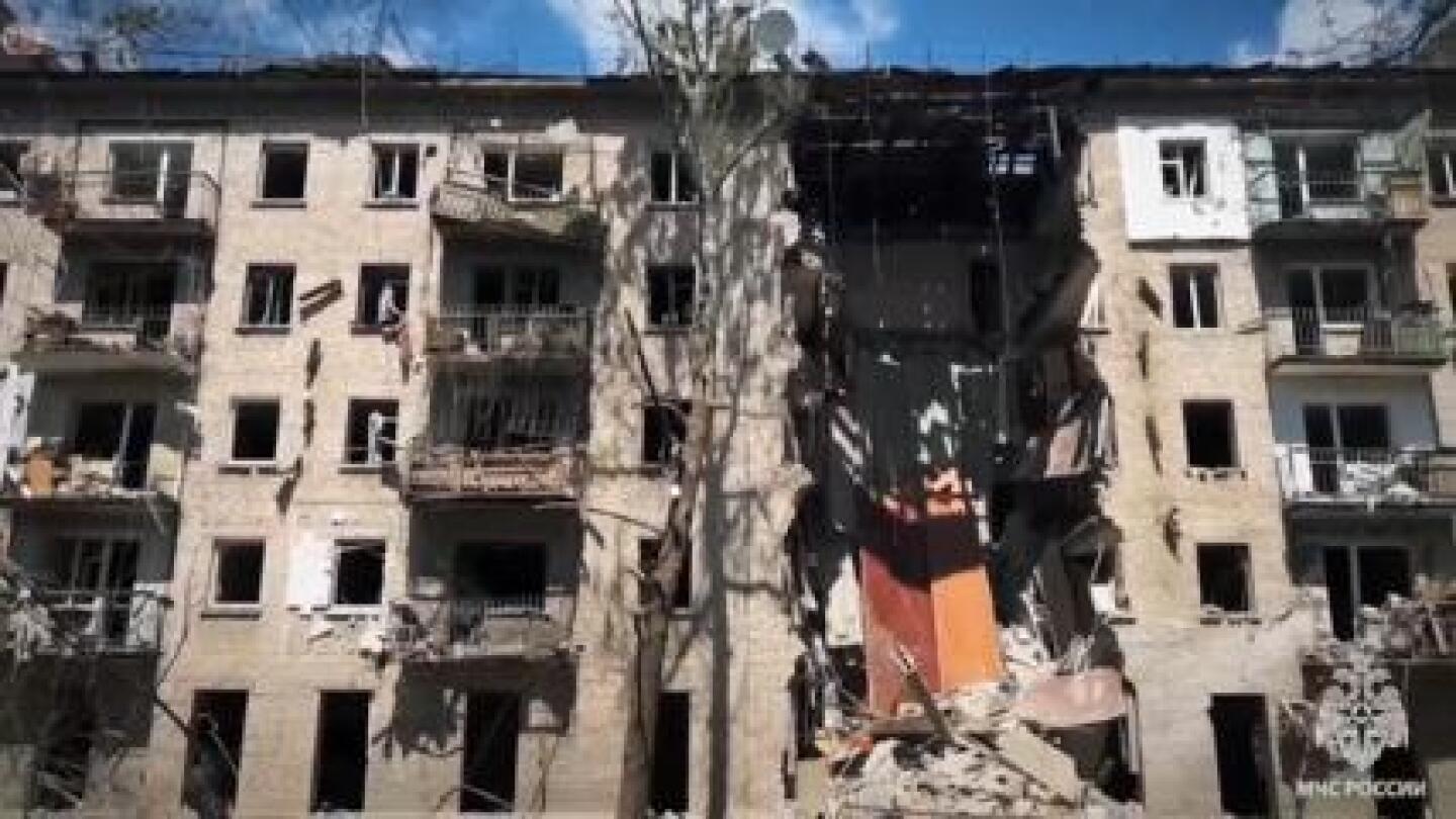 At least three dead as part of residential building collapses in Luhansk after shelling | AP News