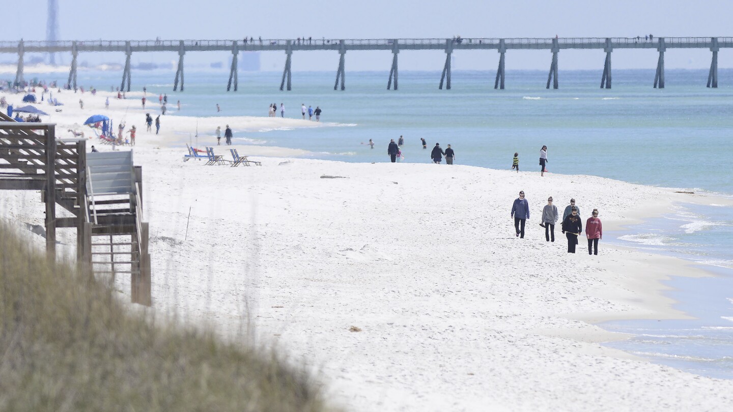 Florida authorities warn of shark dangers along Gulf Coast beaches after 3 people are attacked