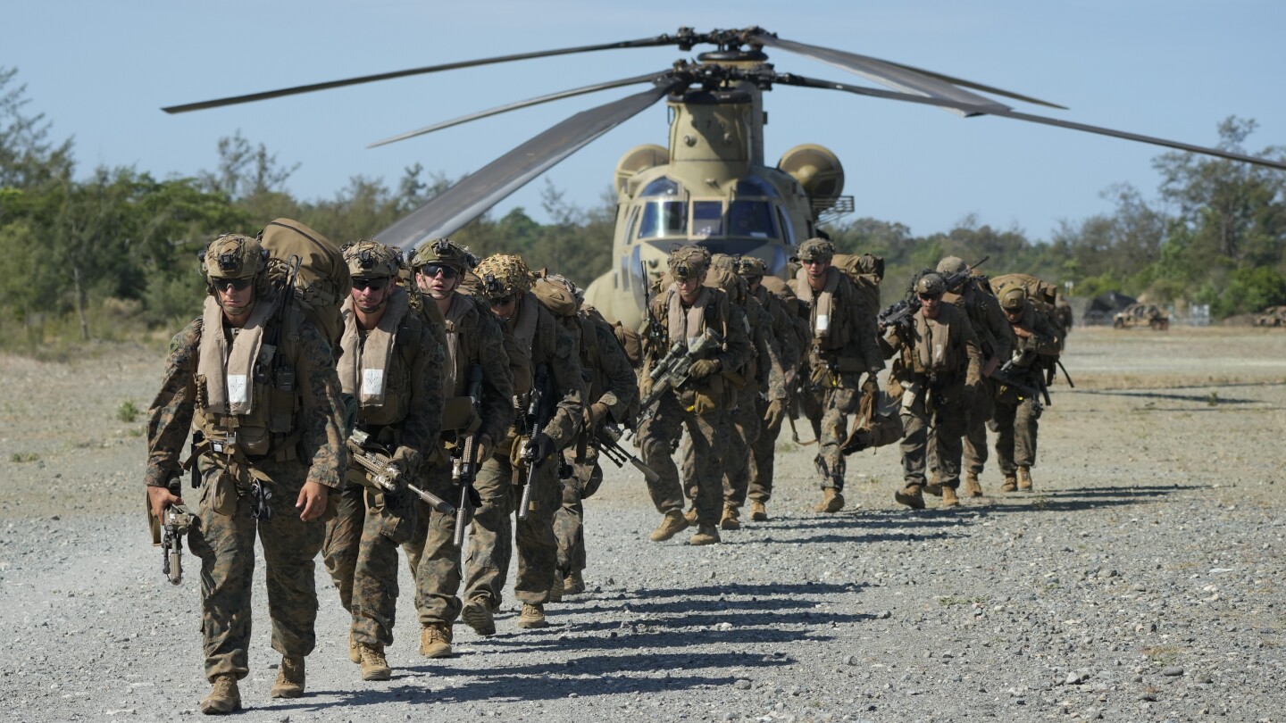 US and Filipino forces end war drills that tested their endurance in brutal heat and shifty weather