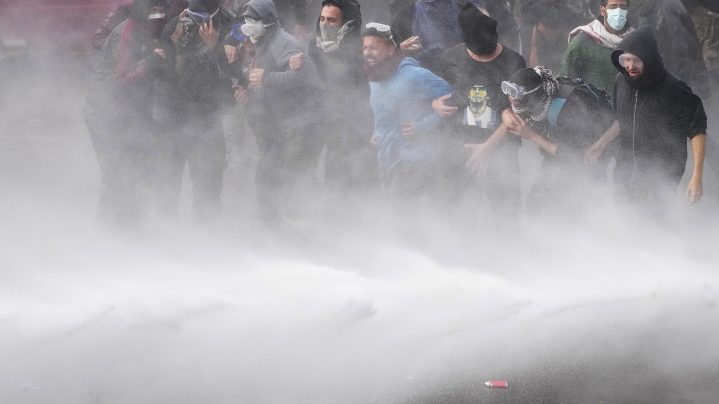 Argentine riot police disperse protesters with water cannons ahead of key Senate vote