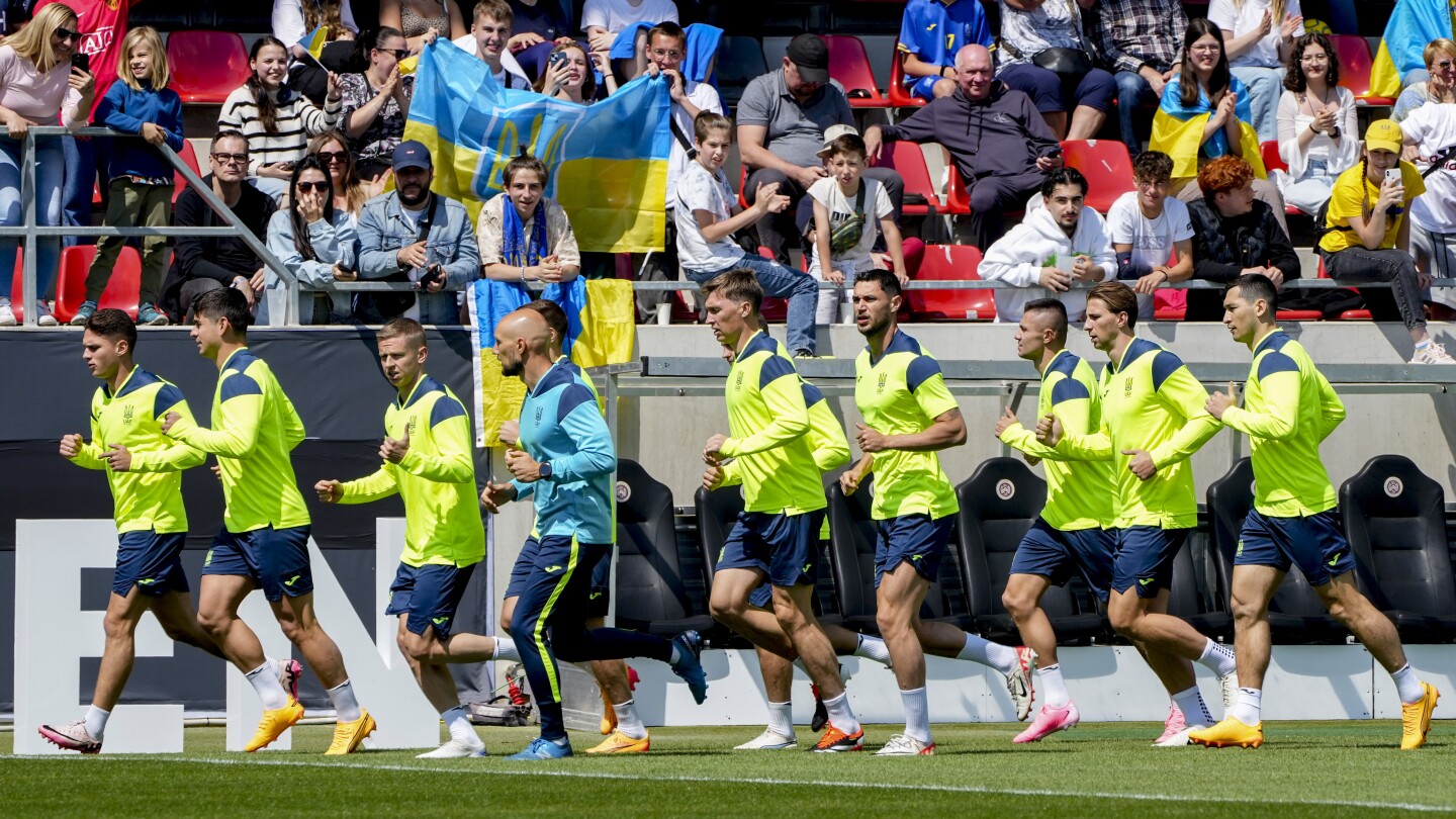 Ukraine arrives at Euro 2024 to a patriotic welcome and vivid reminder of the war at home