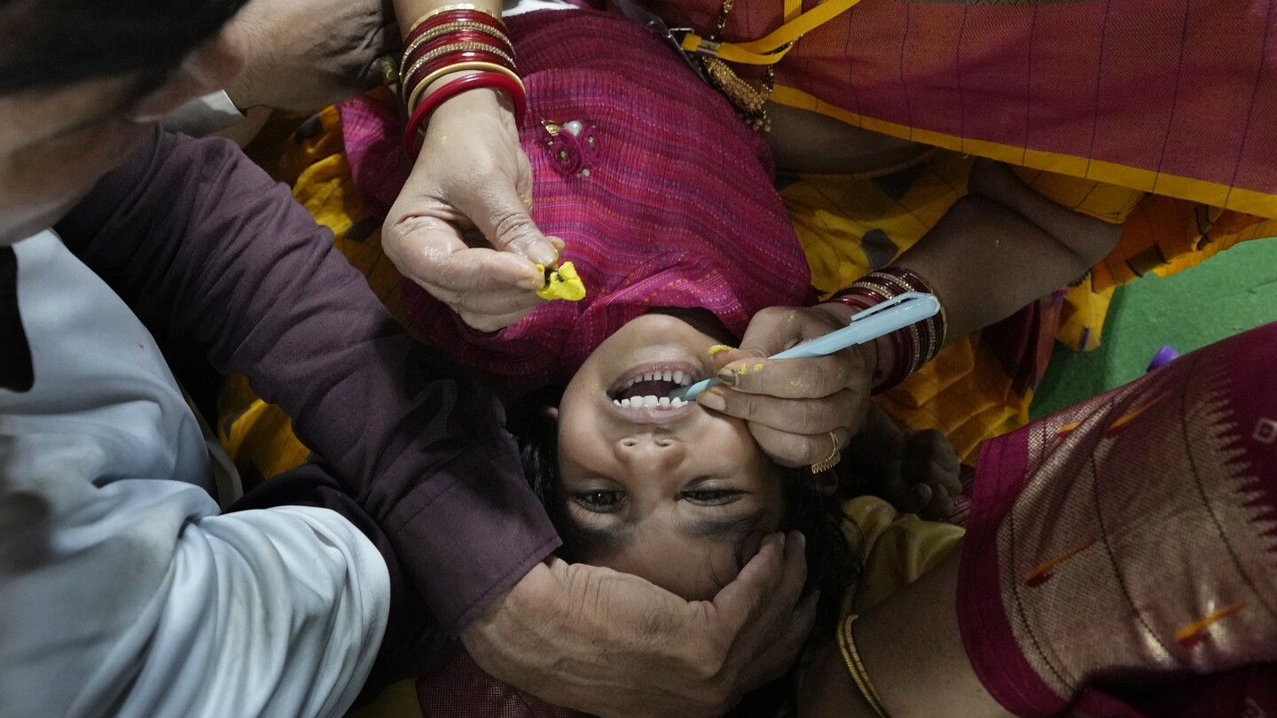 AP PHOTOS: Myriad people flock to Indian city to swallow live fish with ‘miracle cure’ to asthma