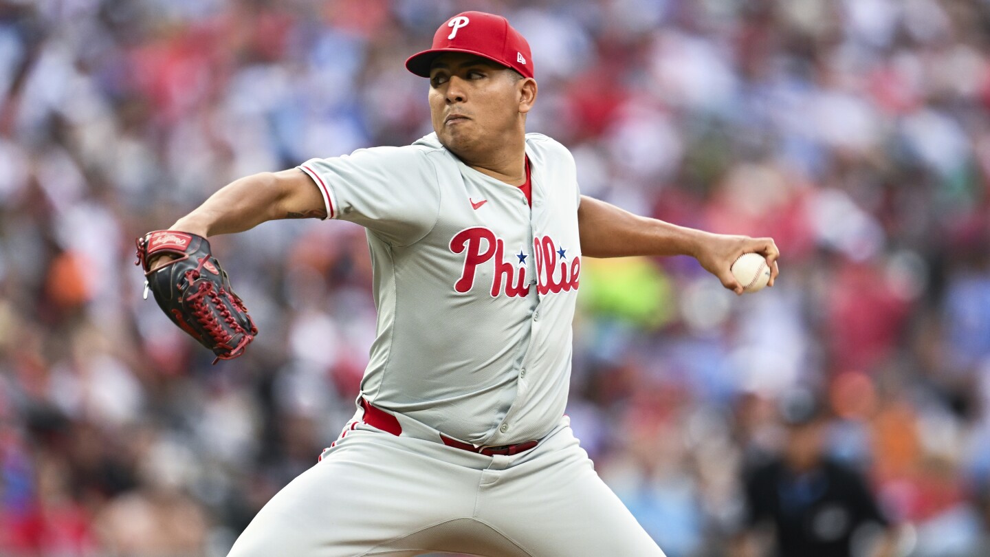 Phillies wait out an extra-inning rain delay, then outlast the Orioles 5-3 in 11