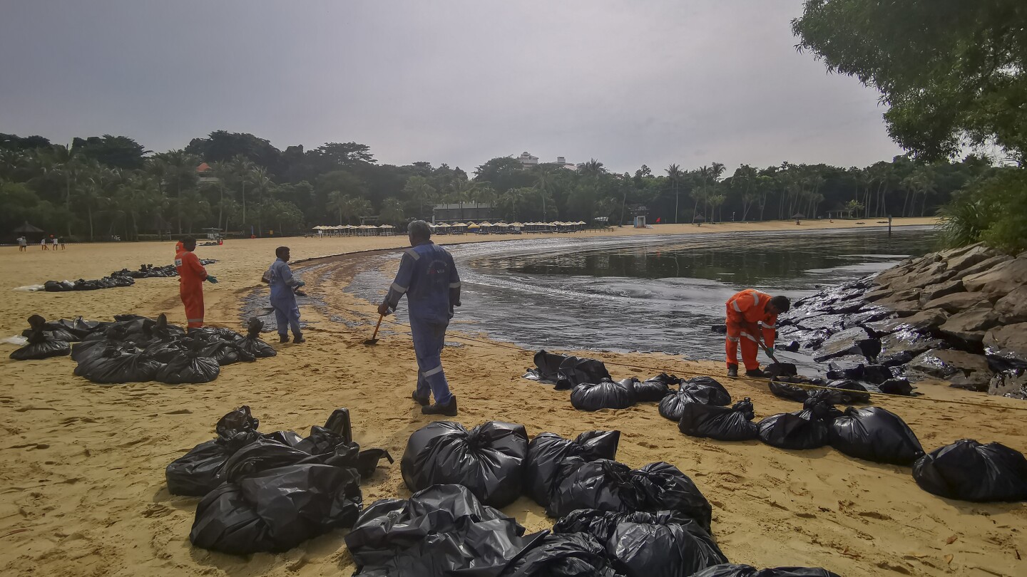 Singapore rushes to clean-up oil slick after boat hits stationary fuel supply ship