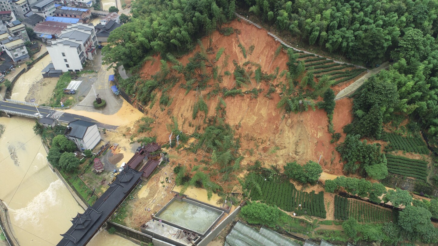 Southern China faces heavy floods, and landslides kill at least 9