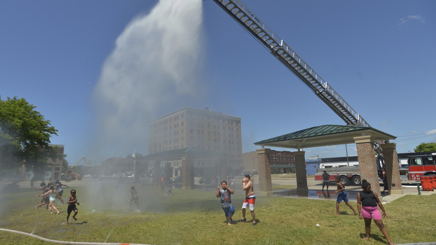 Early blast of heat and humidity leaves millions sweltering across the US