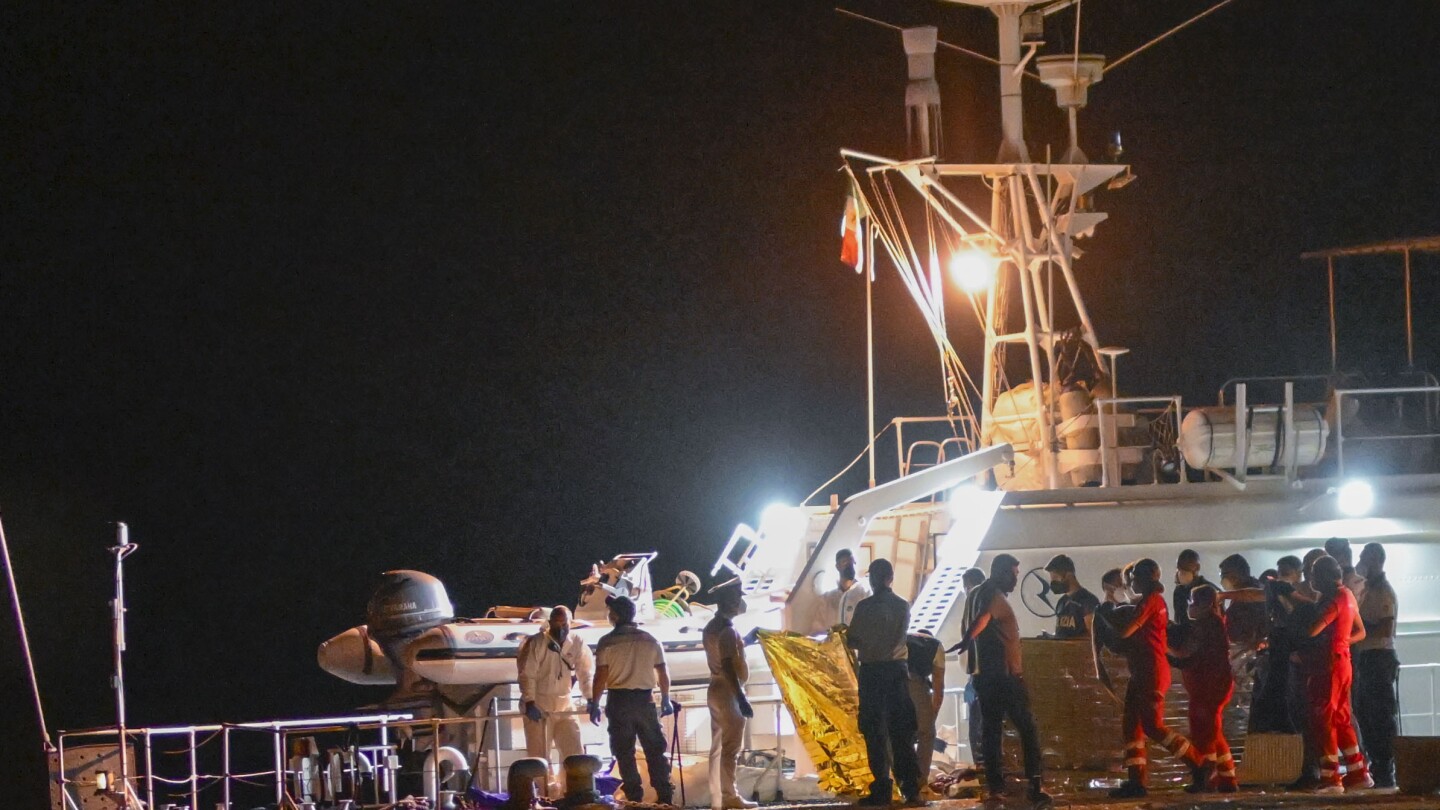 Italy’s coast guard searches for dozens of migrants missing after their ship capsized