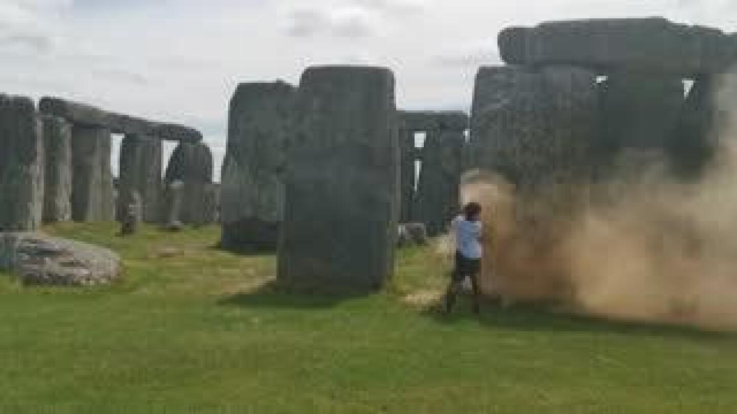 Climate protesters arrested after painting Stonehenge monument orange | AP News