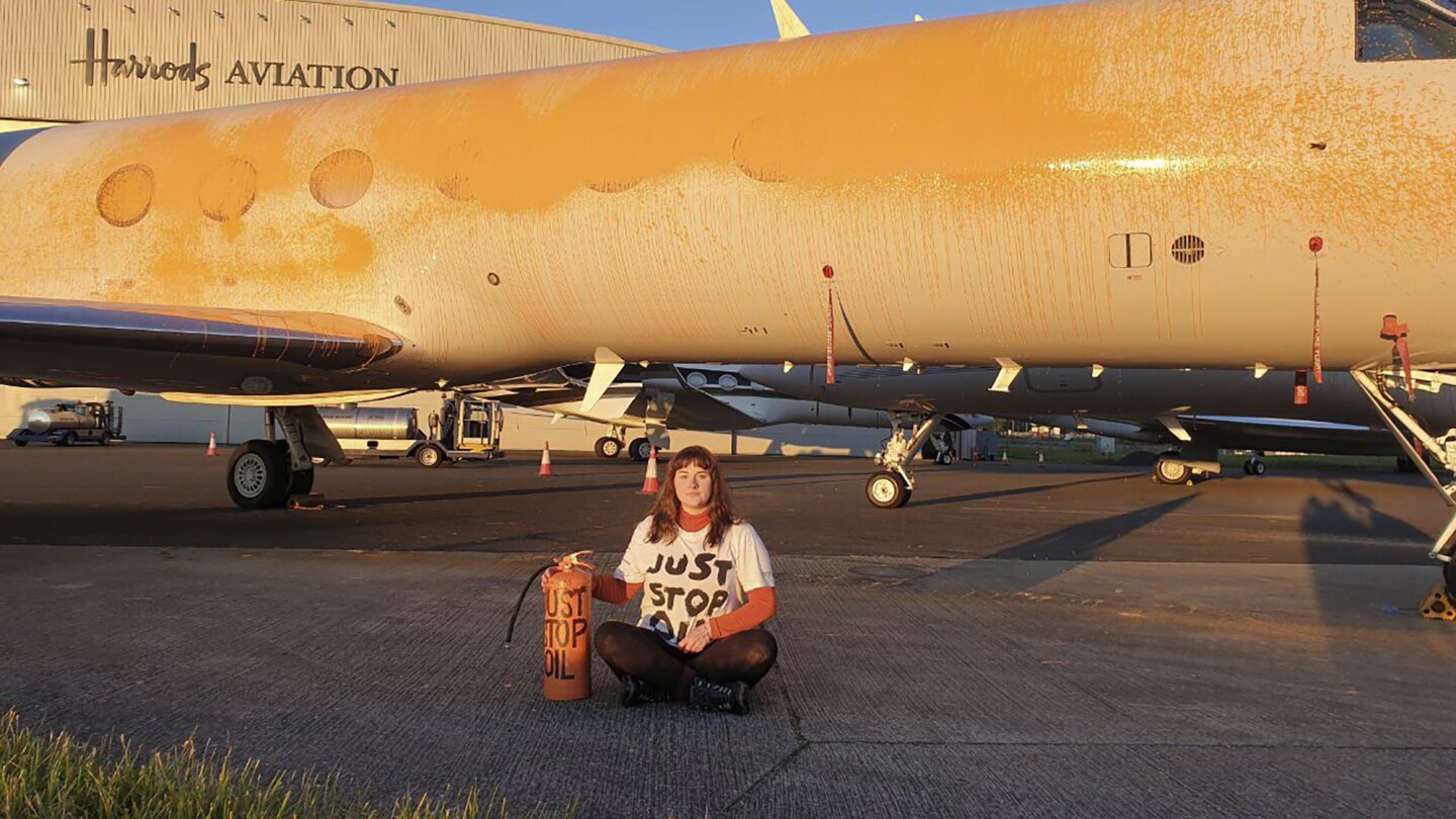 Climate activists arrested for spray-painting private jets orange at London airport