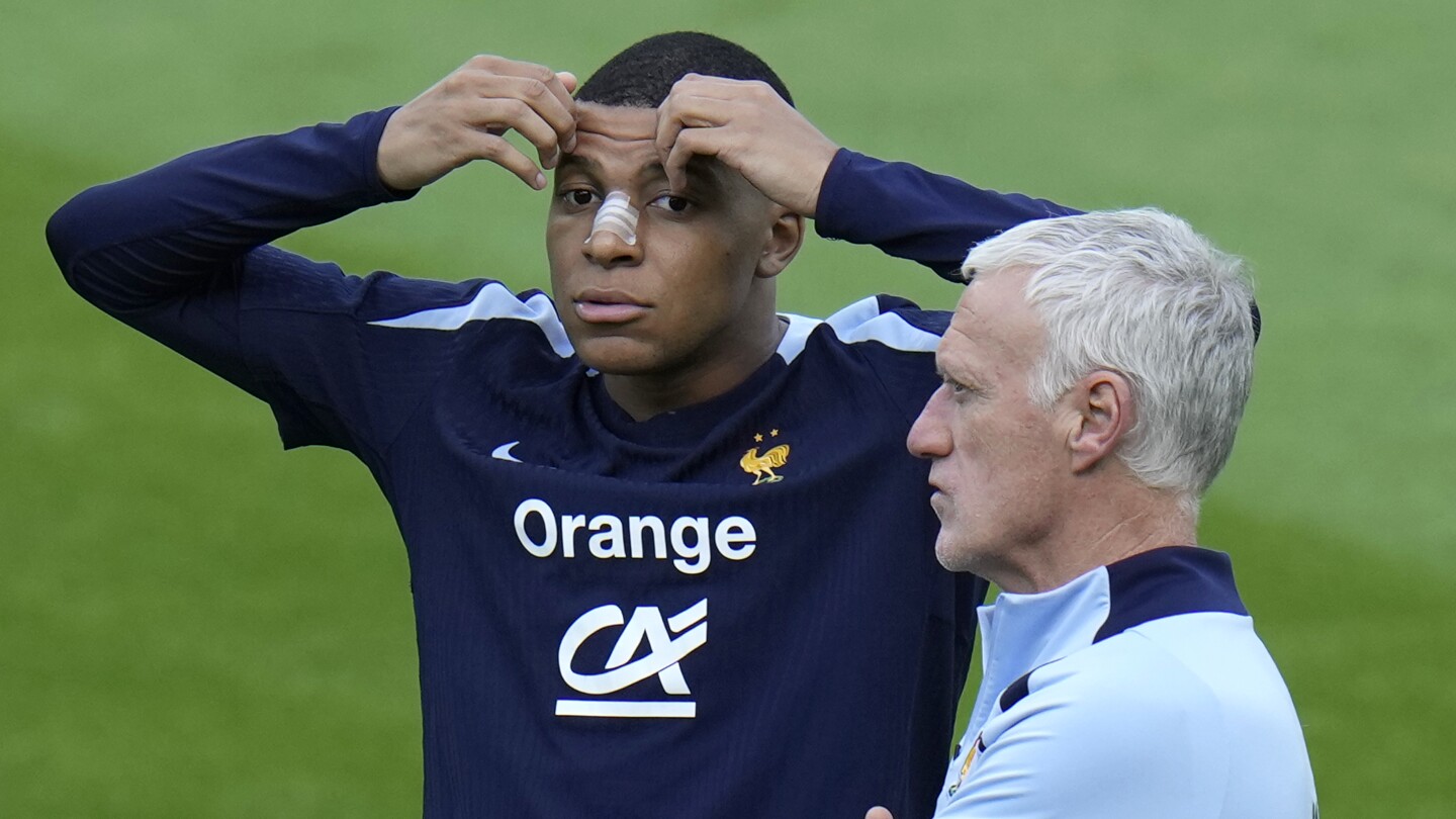 France coach says he assumes masked Mbappé will be available for Netherlands match at Euro 2024