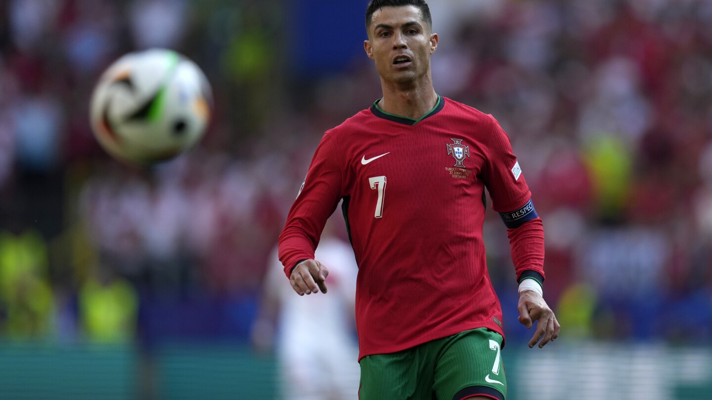 Young fan takes selfie with Cristiano Ronaldo during match at Euro 2024