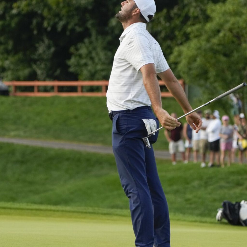 Tom Kim clings to a 1-shot lead over Scheffler and Bhatia in rain-delayed Travelers