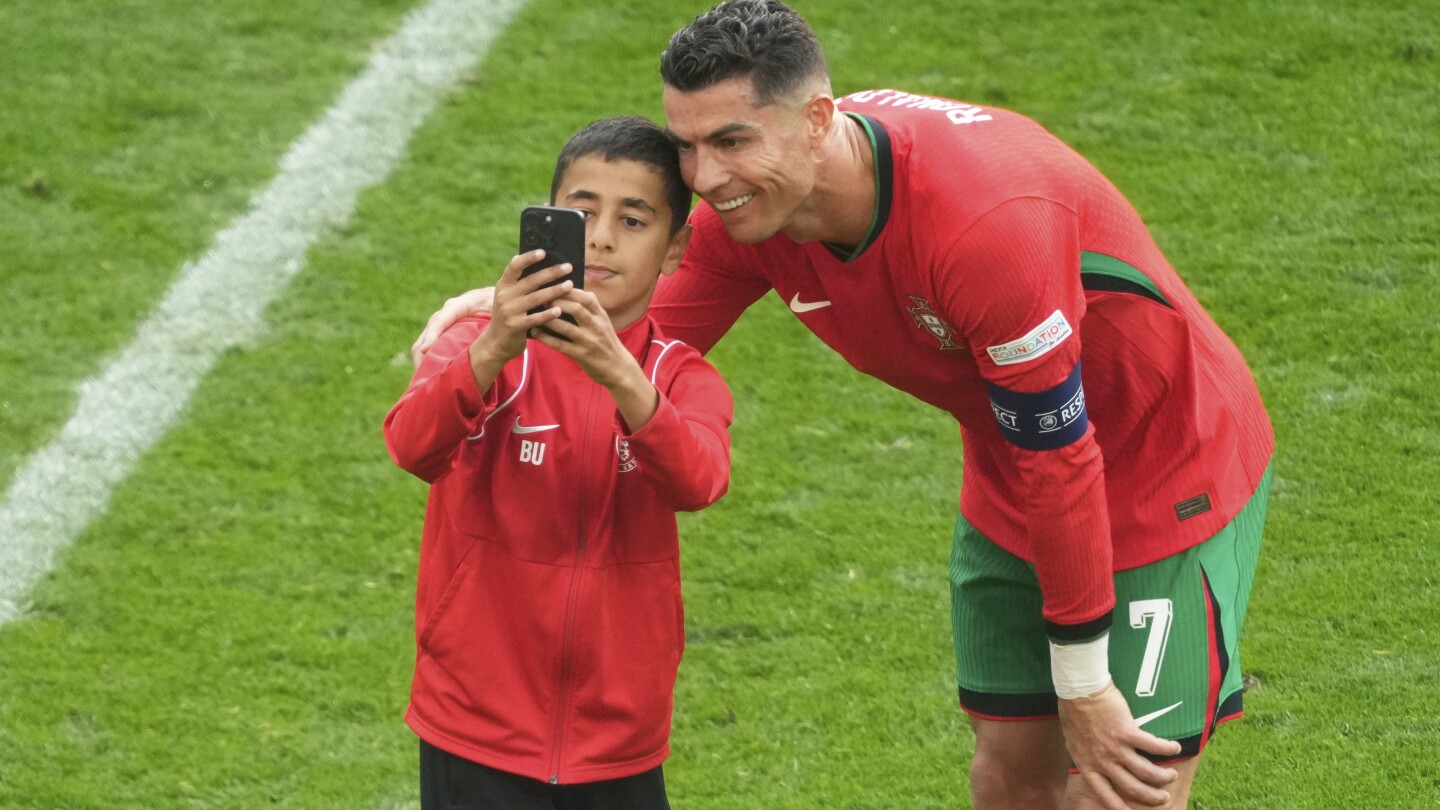 UEFA increases field-side security at Euro 2024 games after selfie-takers pursue Cristiano Ronaldo