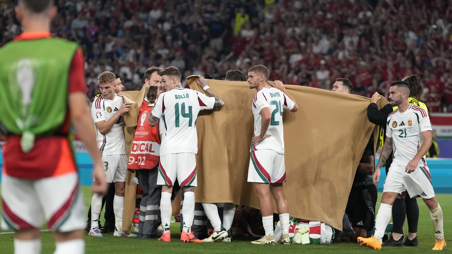 Hungary forward Barnabás Varga stretchered off after serious-looking injury against Scotland