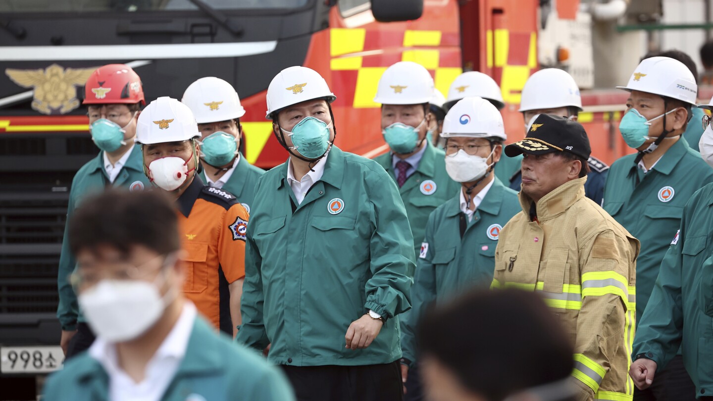 South Korean rescuers search burned factory after a blaze killed 22, mostly Chinese migrants