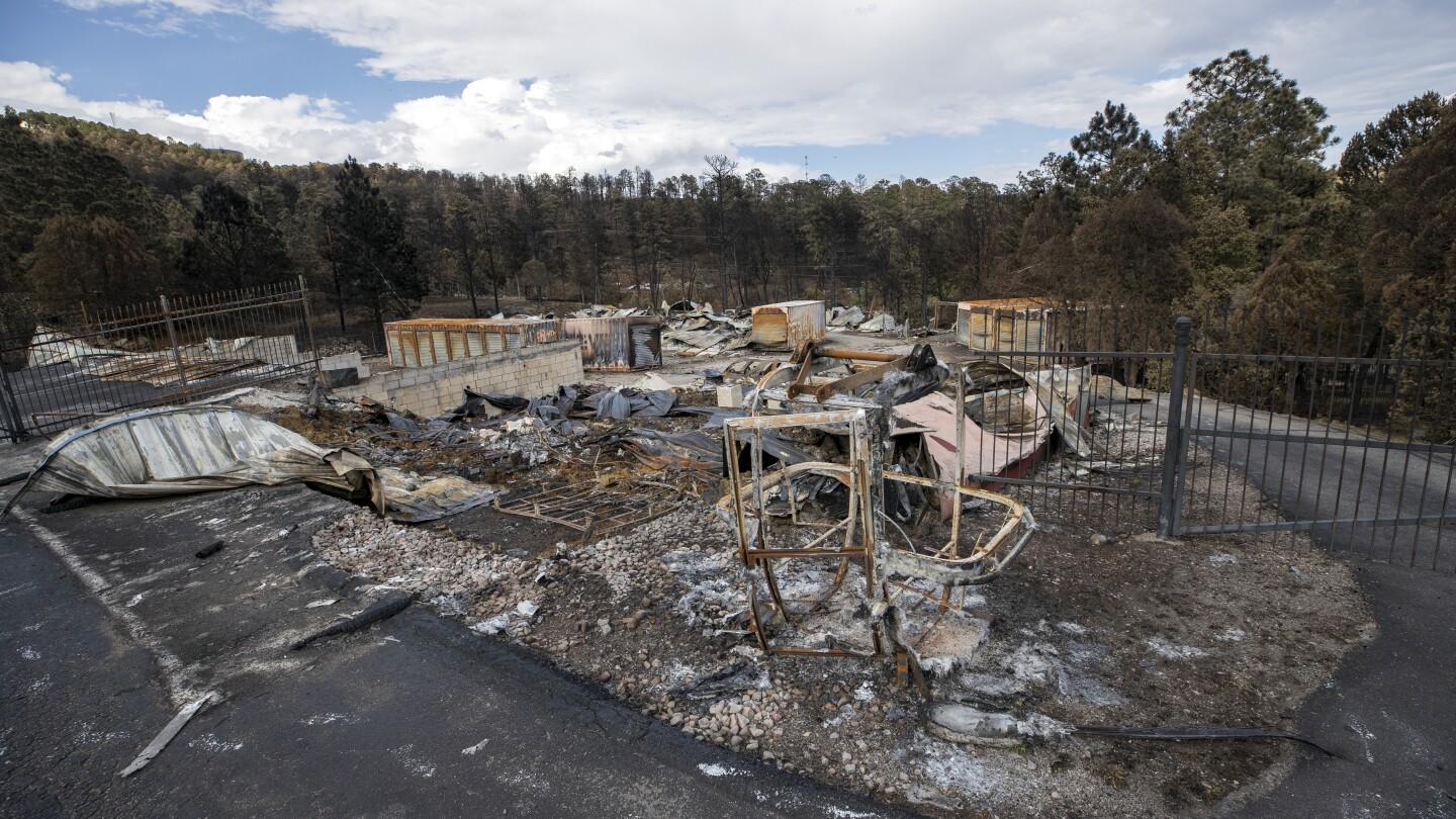 Team combs fire-ravaged New Mexico community for remains of the missing