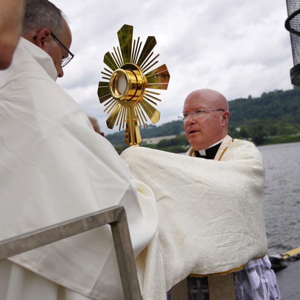 On heartland roads, and a riverboat, devout Catholics press on with two-month nationwide pilgrimage