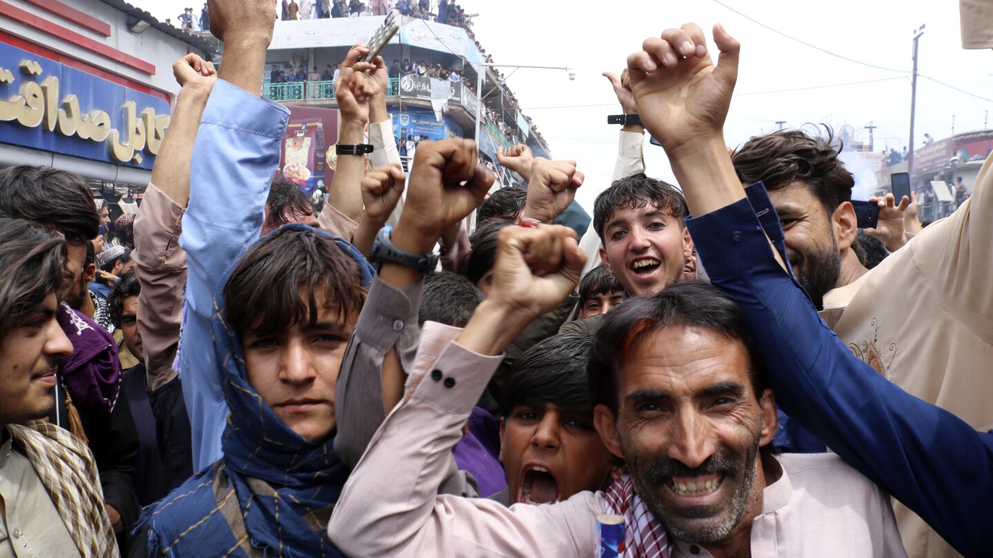 Afghans celebrate their men’s cricket team reaching first Twenty20 World Cup semifinals