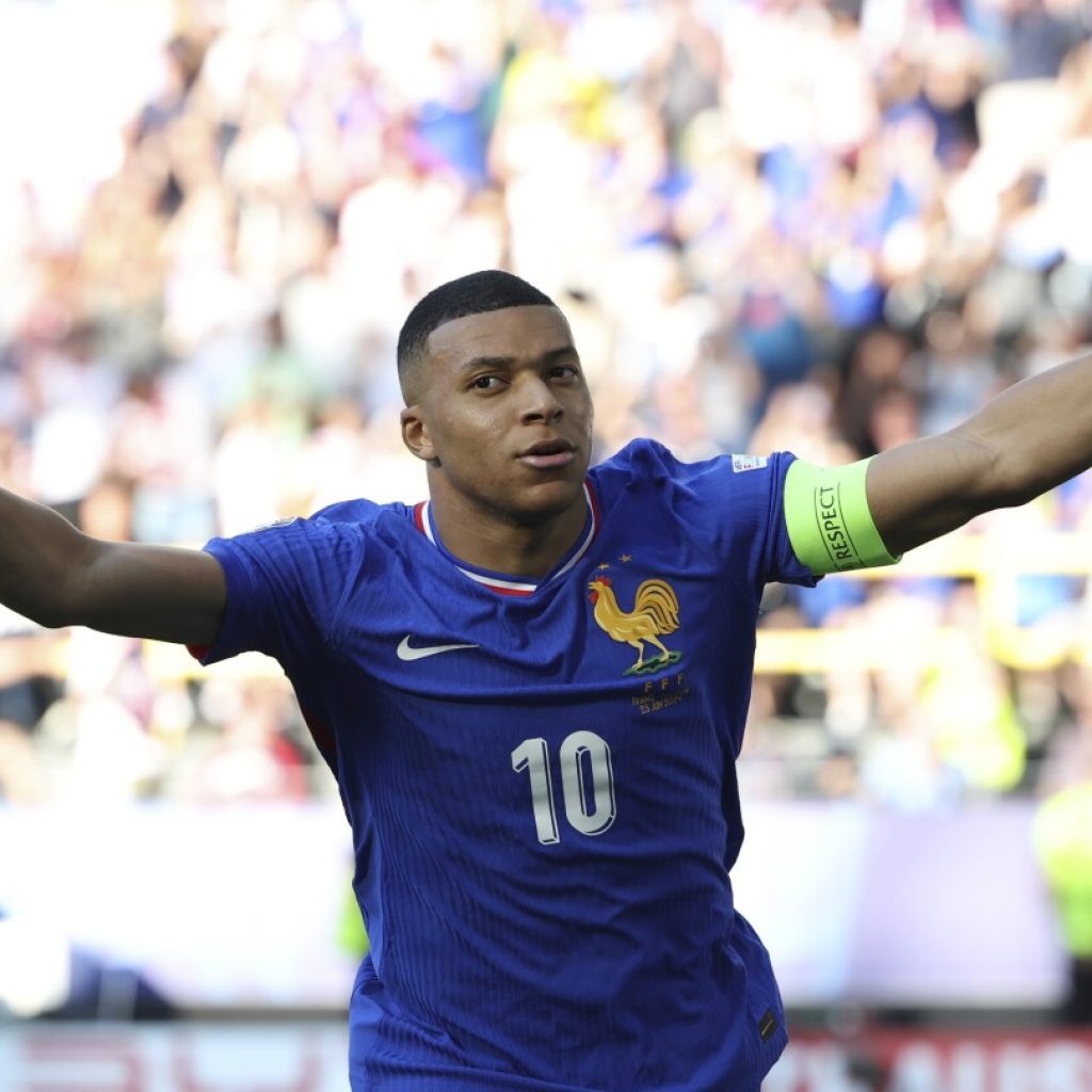 Kylian Mbappé scores on return from broken nose and France draws 1-1 with Poland at Euro 2024