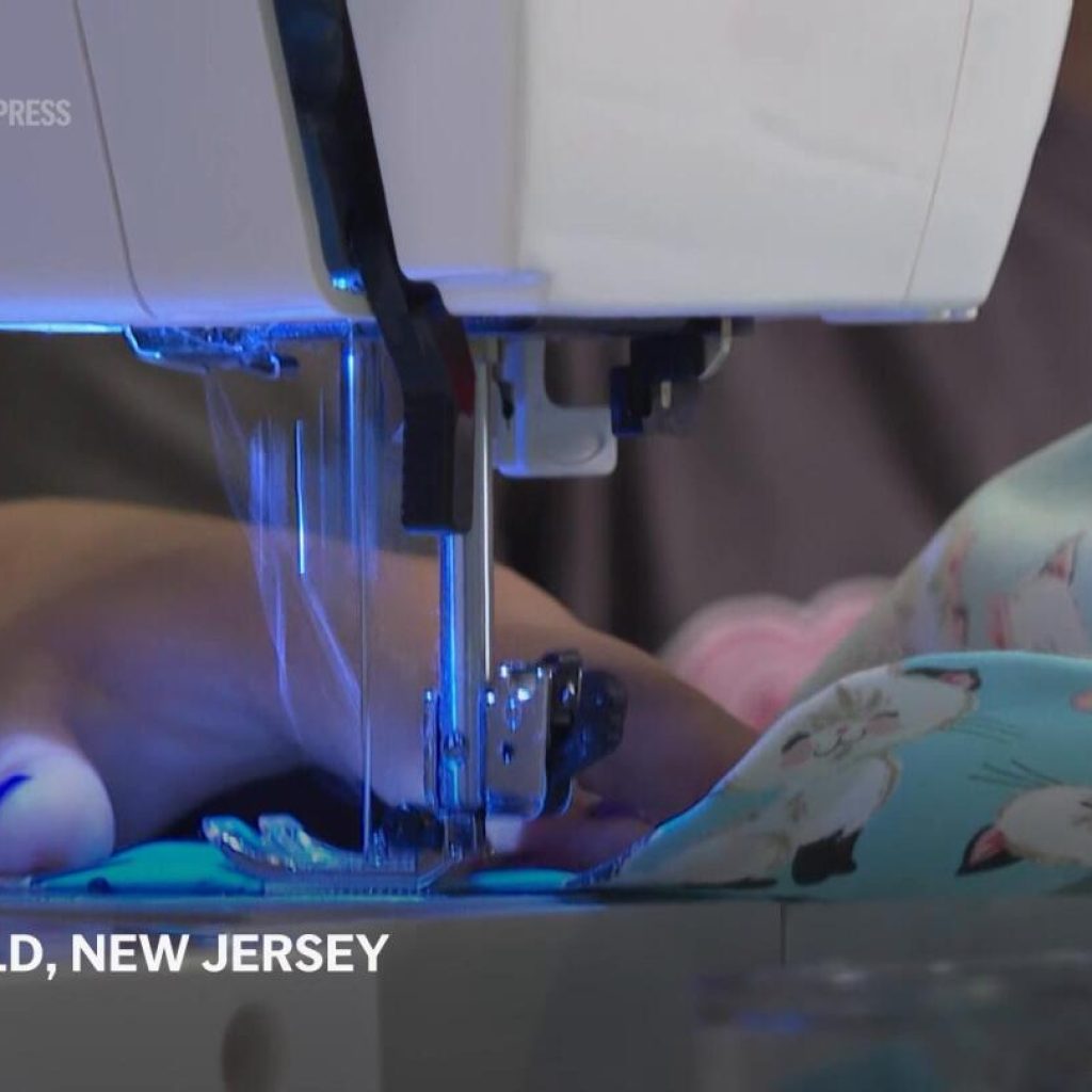 Baby cousin with cancer inspires girls to sew hospital gowns for sick kids | AP News