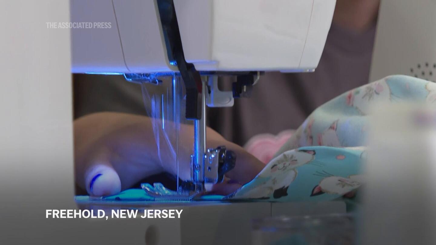 Baby cousin with cancer inspires girls to sew hospital gowns for sick kids | AP News