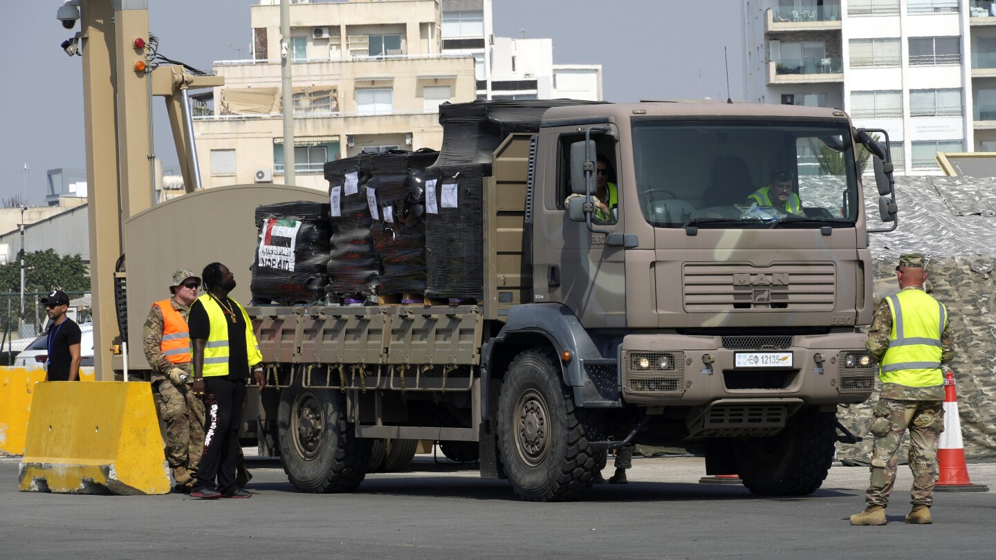 Gunfire, lawlessness and gang-like looters are preventing aid distribution in Gaza, an official says