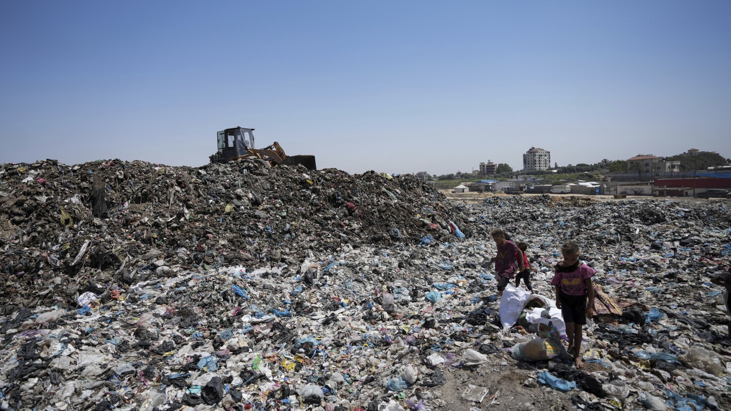 In the searing heat of the Gaza summer, Palestinians are surrounded by sewage and garbage