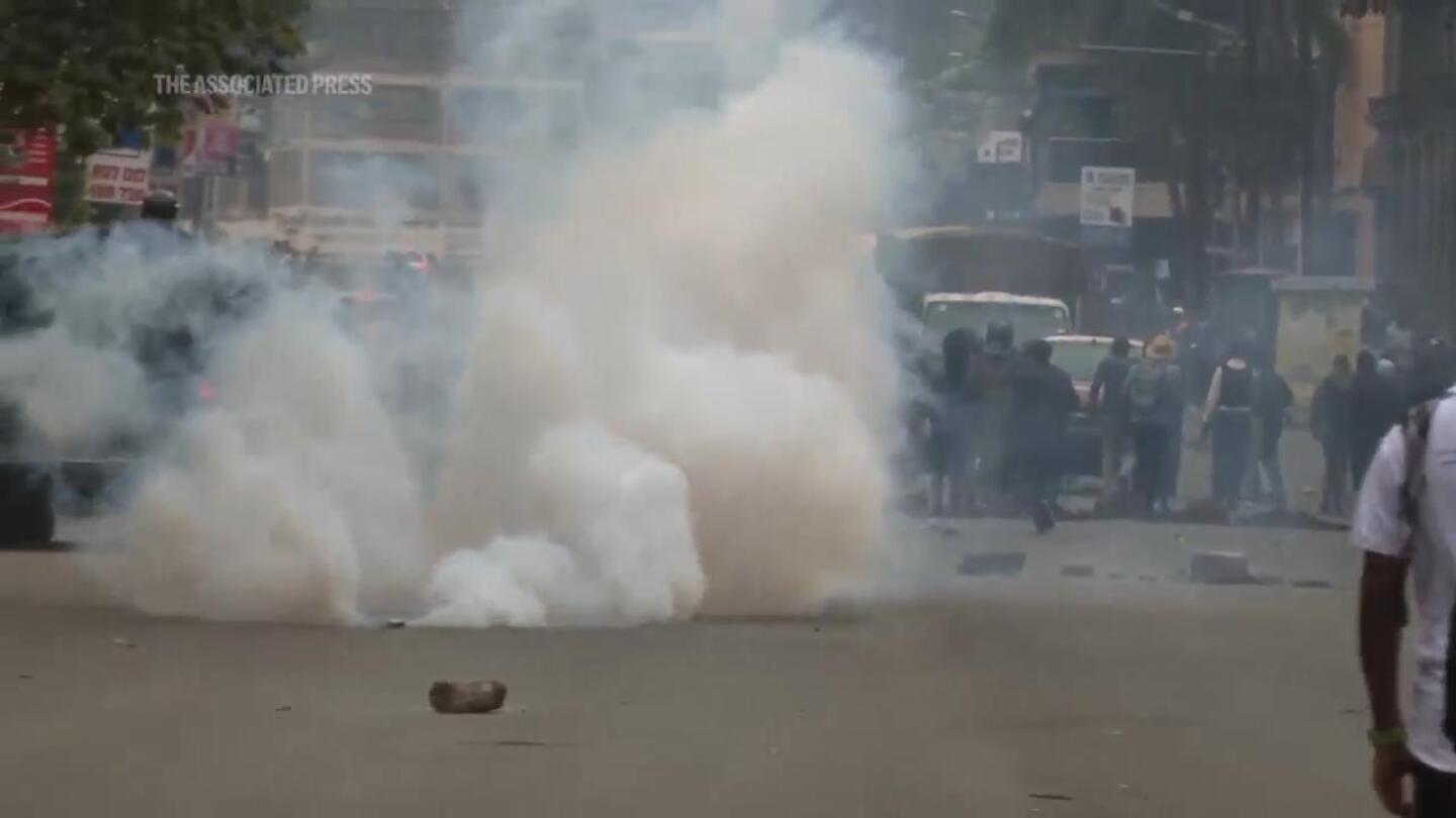 Kenyan police use tear gas to try to disperse ongoing protests against finance bill | AP News