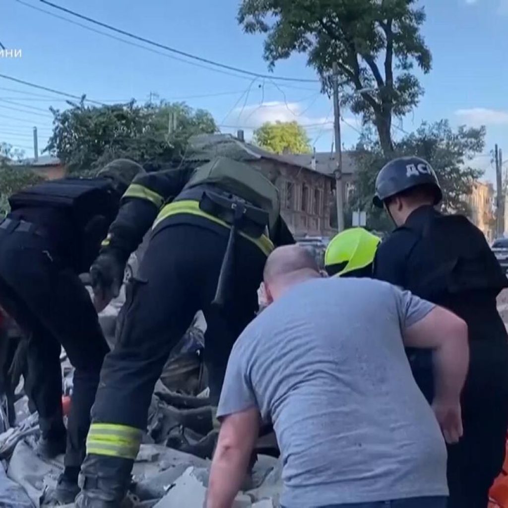 Injured man cut out of car caught in falling debris after Russian strike on Dnipro | AP News