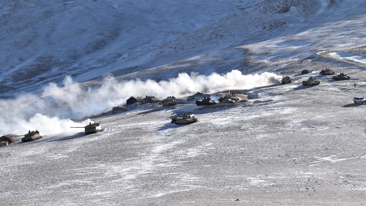 An Indian military tank sinks while crossing a river in a region bordering China, killing 5 soldiers