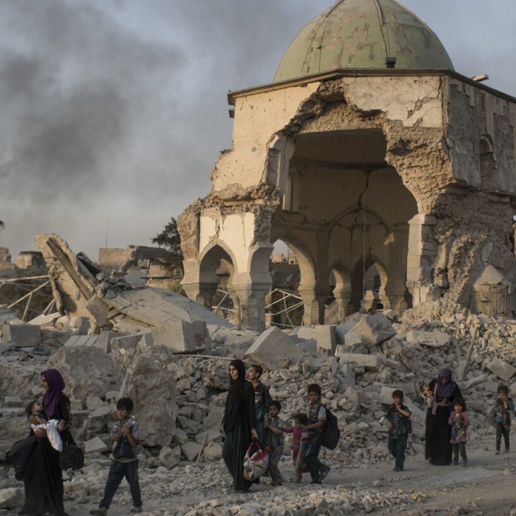 UNESCO finds Islamic State group-era bombs in Mosul mosque walls, years after the defeat of IS