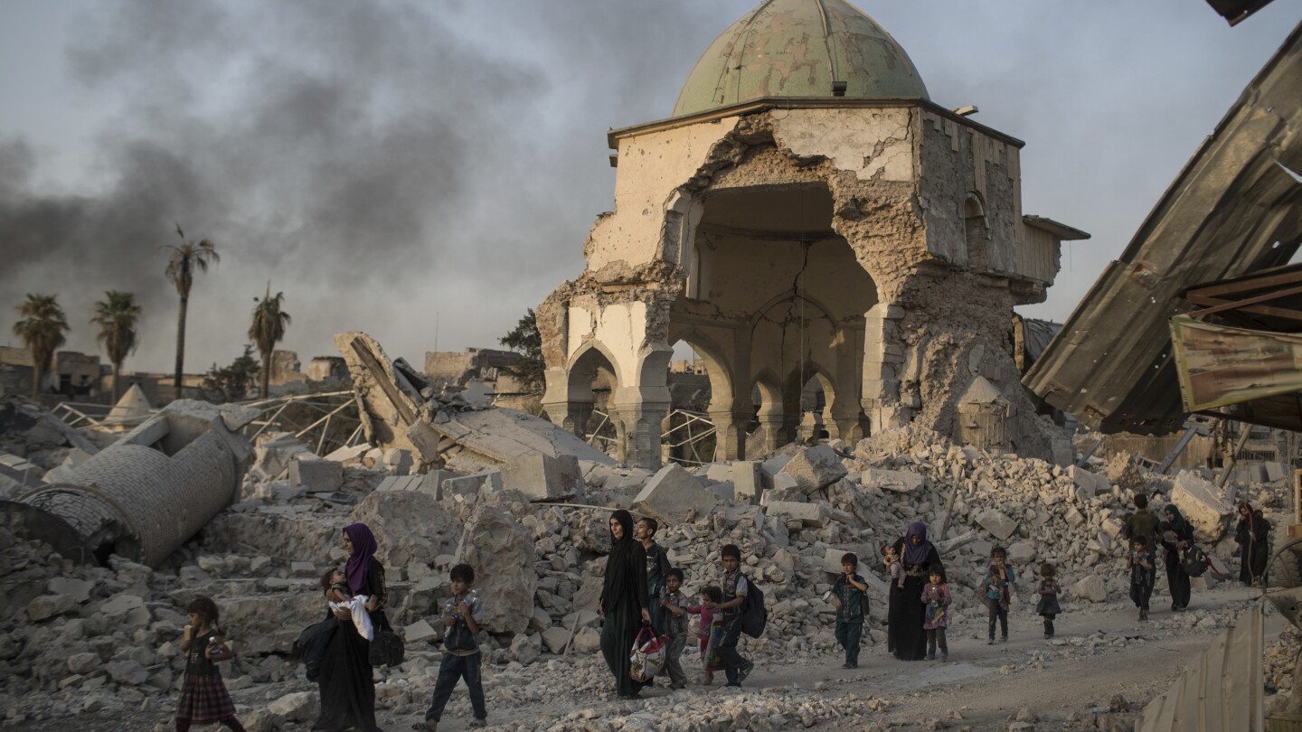 UNESCO finds Islamic State group-era bombs in Mosul mosque walls, years after the defeat of IS