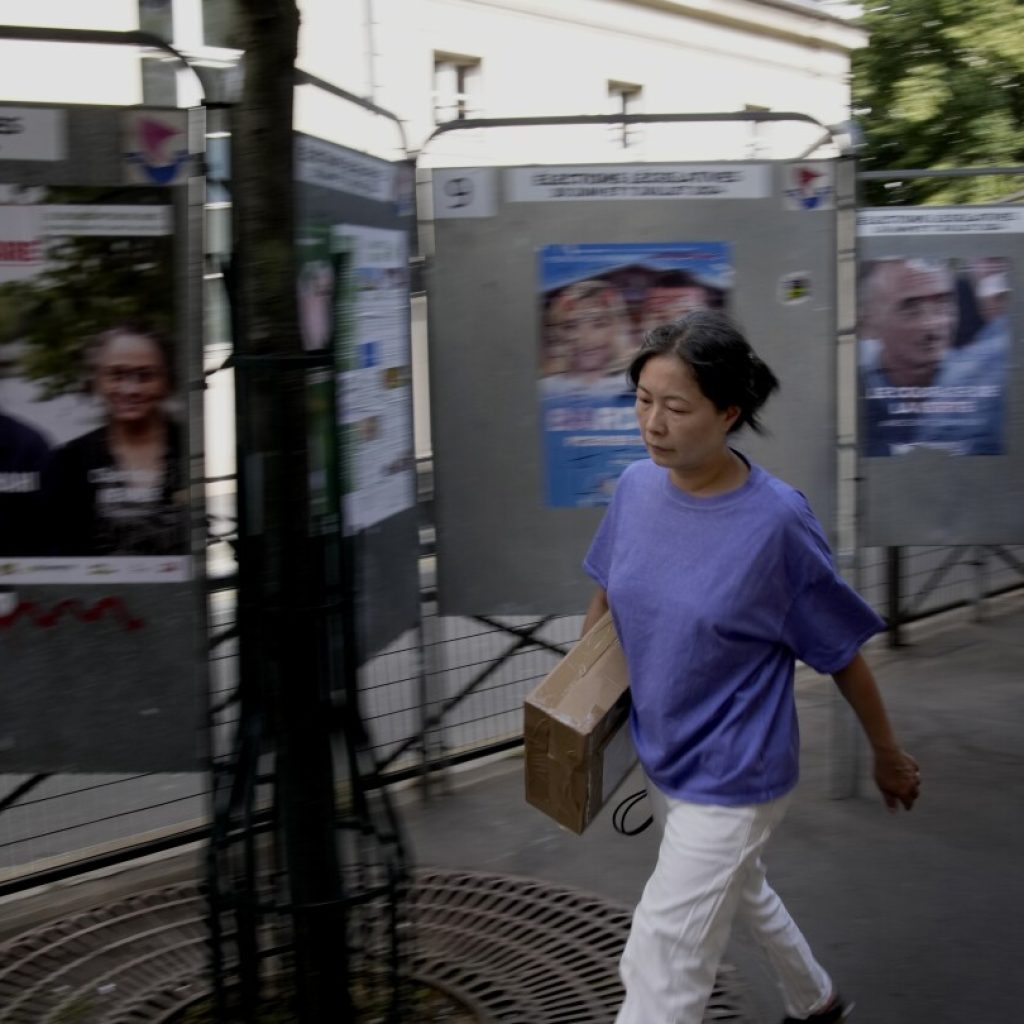 The Latest | Polls are open in France’s early legislative election