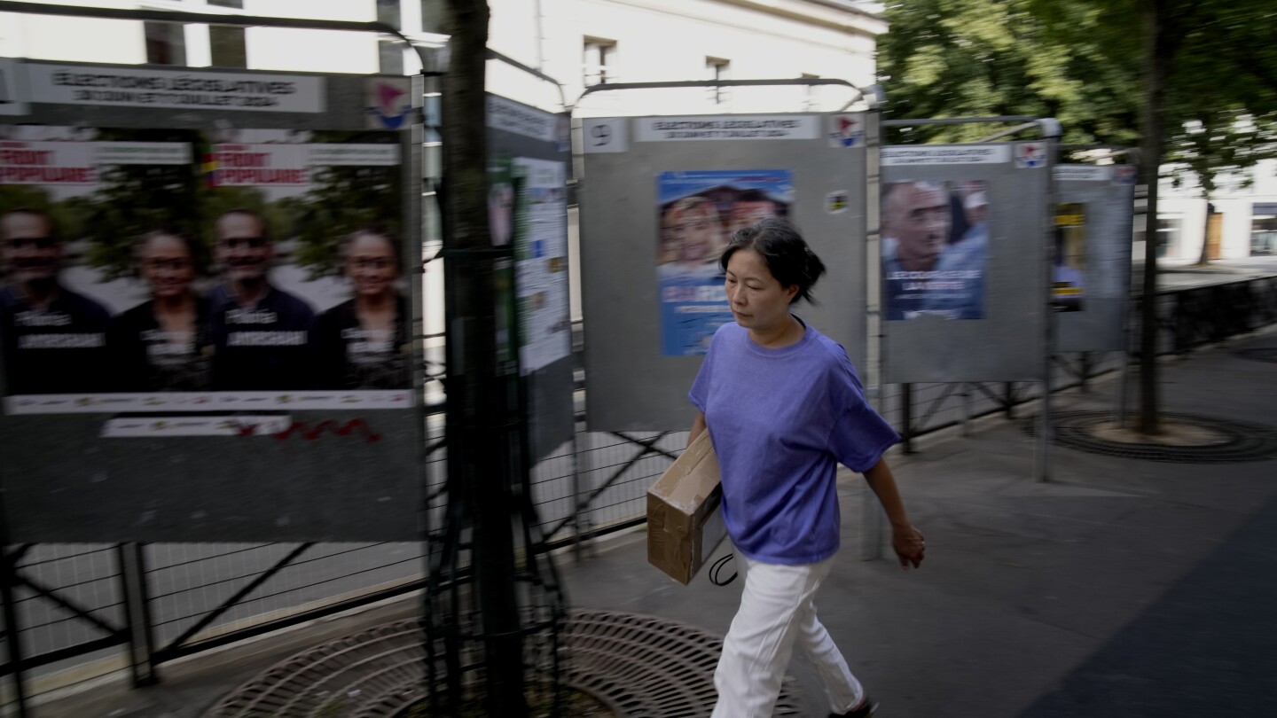 The Latest | Polls are open in France’s early legislative election