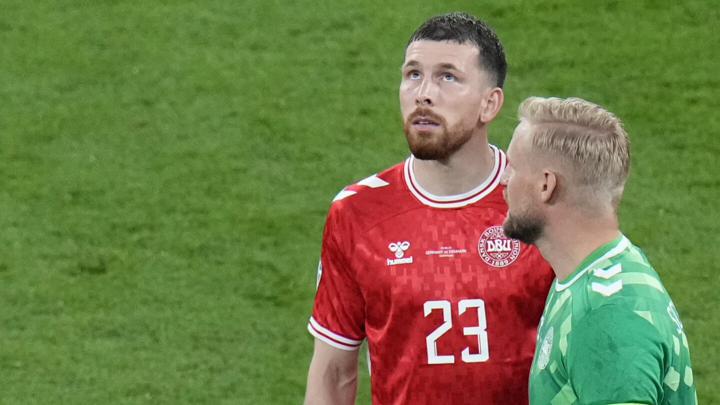 German police believe man who climbed arena roof during Euro 2024 game was a would-be photographer