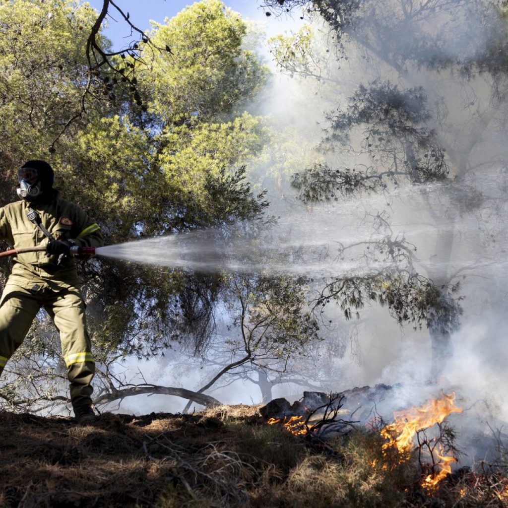 Two wildfires are burning near Greece’s capital, fueled by strong winds