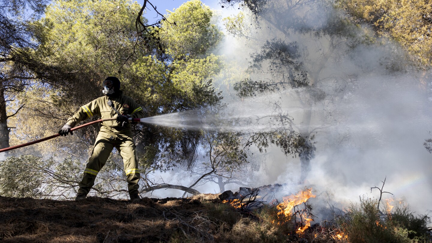 Two wildfires are burning near Greece’s capital, fueled by strong winds