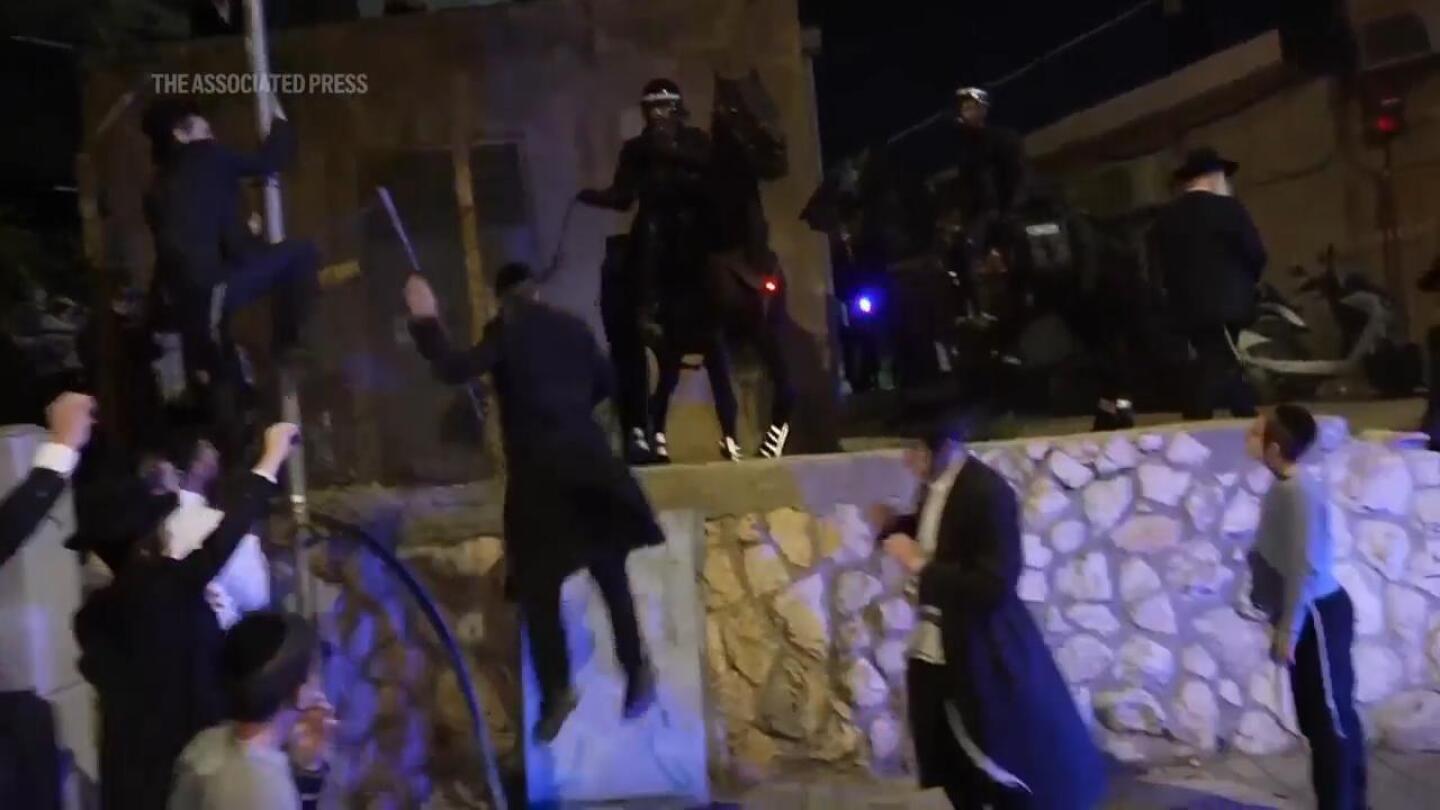 Scuffles in Jerusalem as ultra-Orthodox men protest ruling on Israel army enlistment | AP News