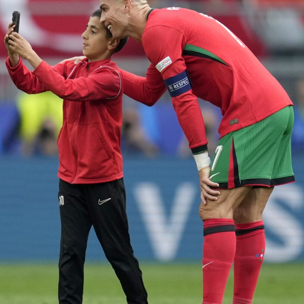 UEFA fines its Euro 2024 co-organizer Germany over selfie-seekers on field with Cristiano Ronaldo