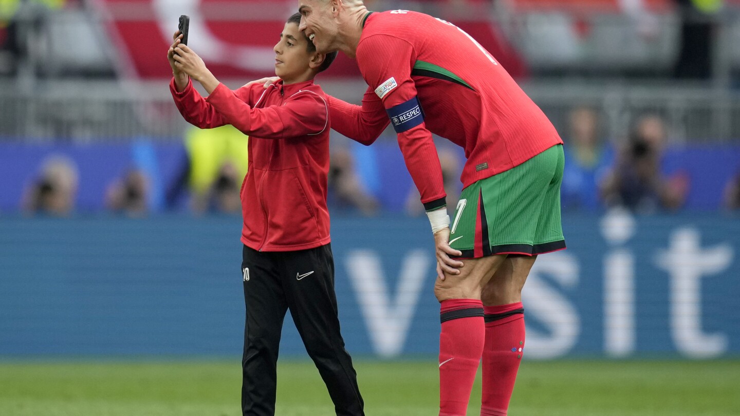 UEFA fines its Euro 2024 co-organizer Germany over selfie-seekers on field with Cristiano Ronaldo