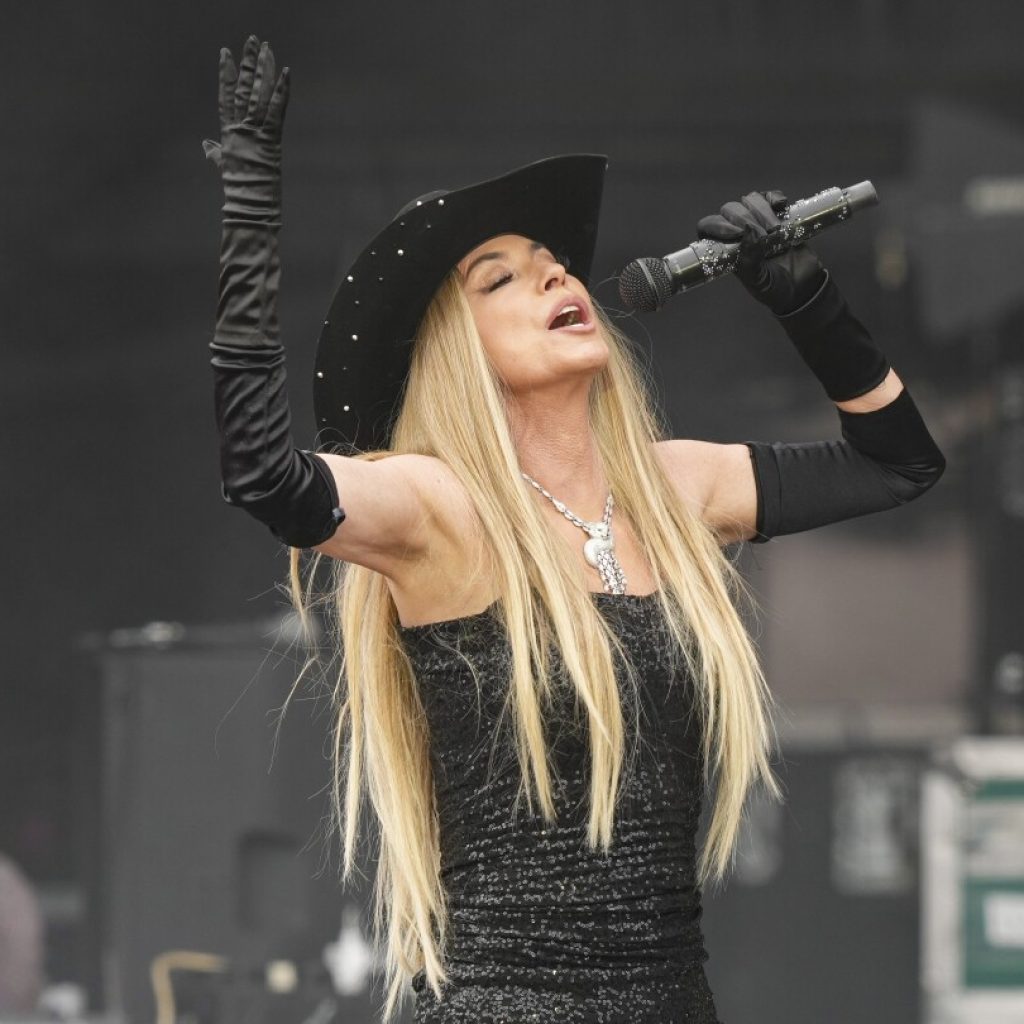 AP Photos: Music fans attend the Glastonbury Festival in England