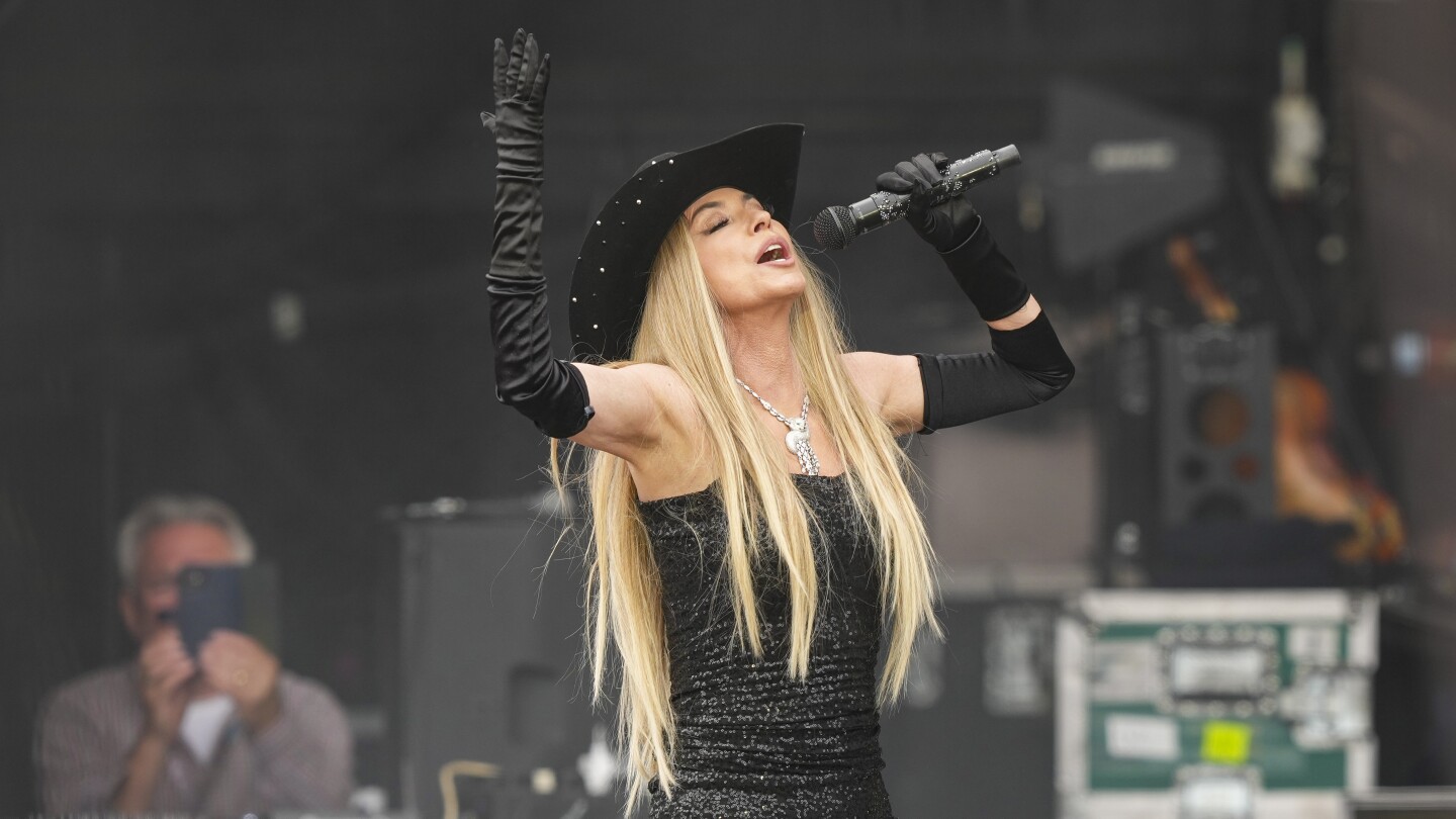 AP Photos: Music fans attend the Glastonbury Festival in England