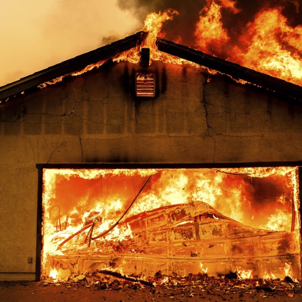 Northern California wildfire spreads, with more hot weather expected. Thousands evacuate