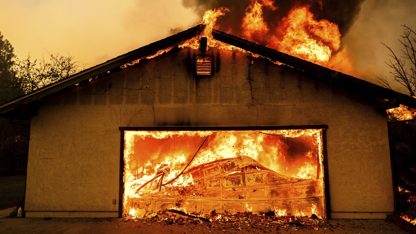 Northern California wildfire spreads, with more hot weather expected. Thousands evacuate