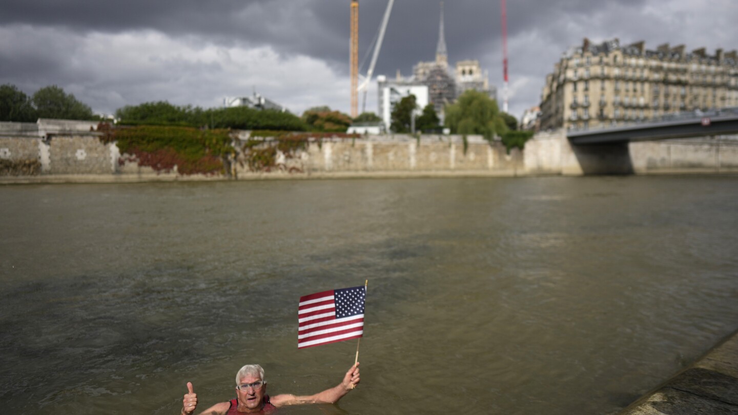 An American swims in Paris’ Seine River before the Olympics despite contamination concerns