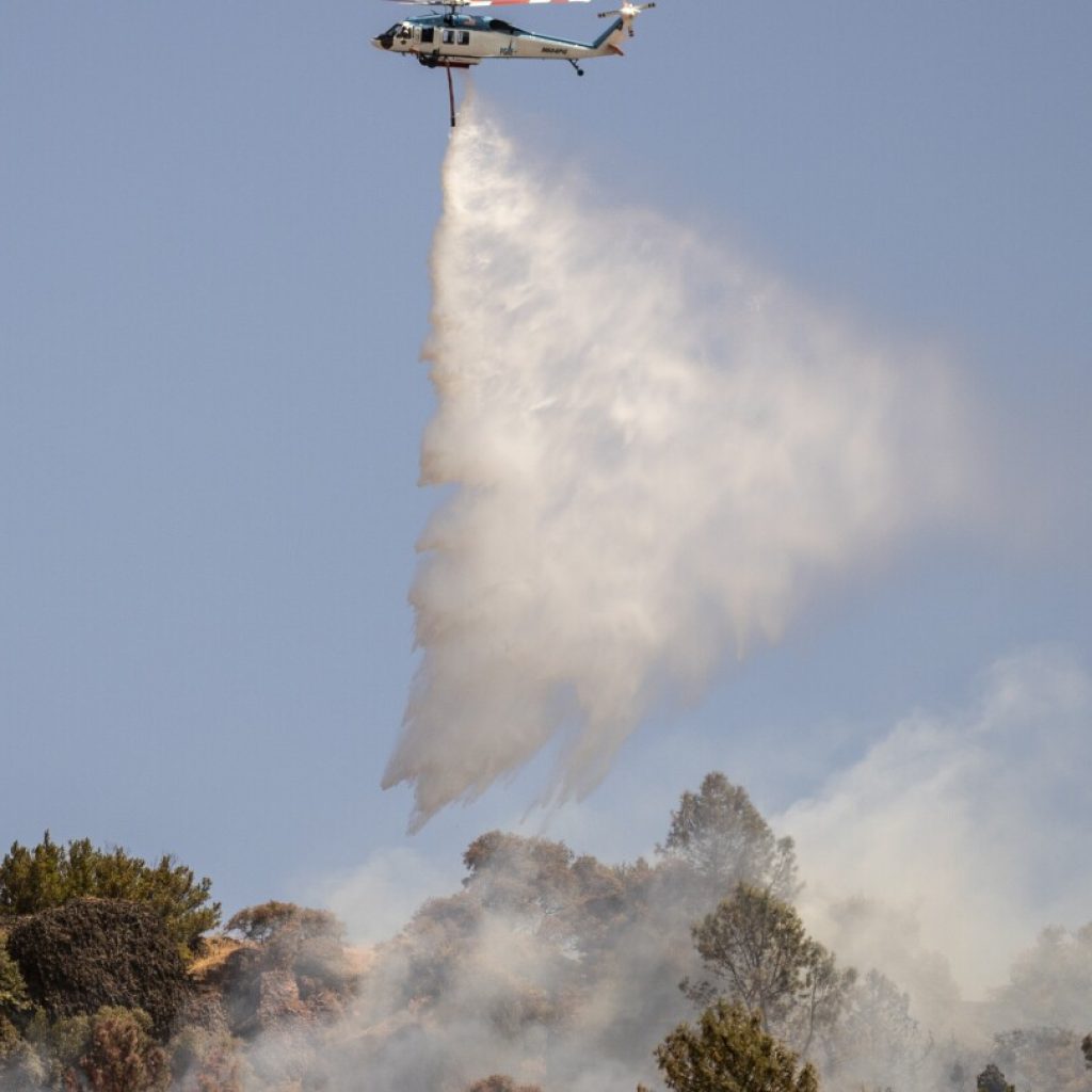 Northern California wildfire does not grow but winds and hot weather could whip up flames