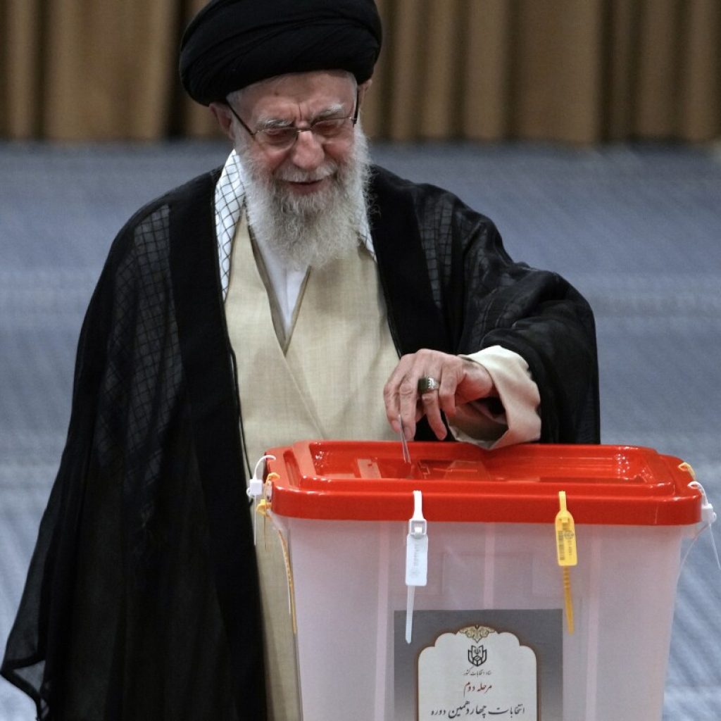 Iran holds runoff presidential vote pitting hard-line former negotiator against reformist lawmaker