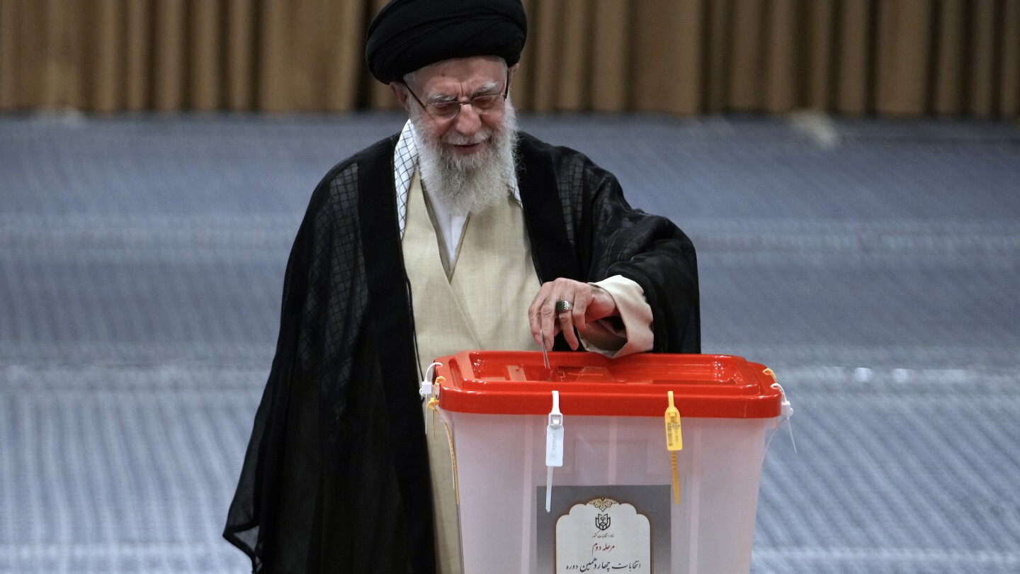 Iran holds runoff presidential vote pitting hard-line former negotiator against reformist lawmaker