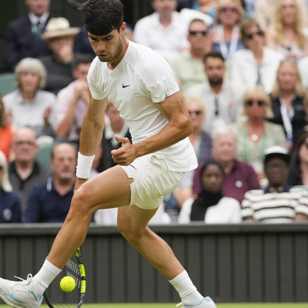 Defending Wimbledon champion Carlos Alcaraz comes back to beat Frances Tiafoe in the third round
